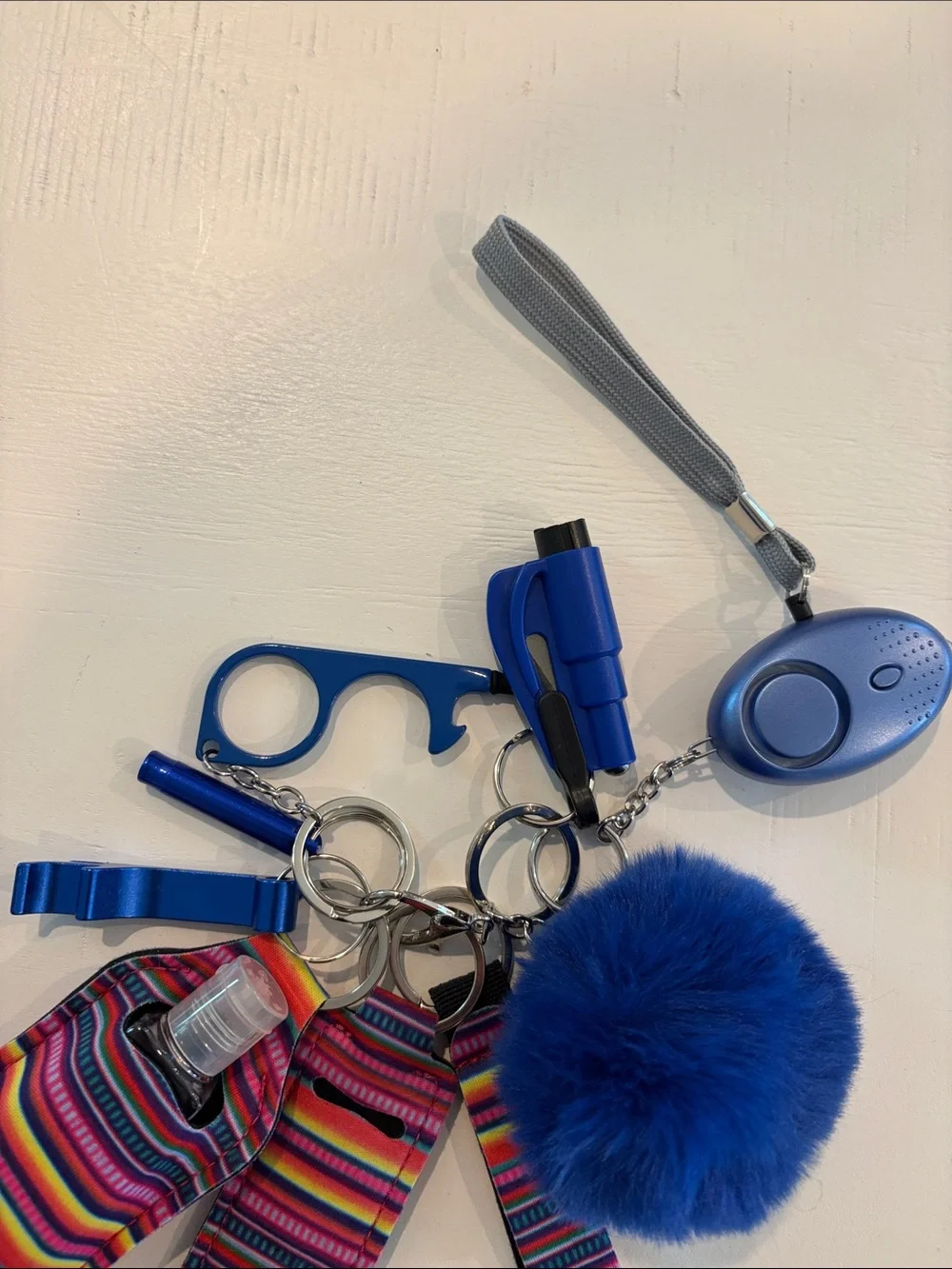 Women’s Blue Pom Pom Keychain Set with Safety Alarm & Sanitizer Holder